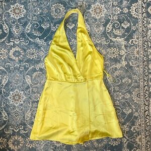 Open back halter neck romper.